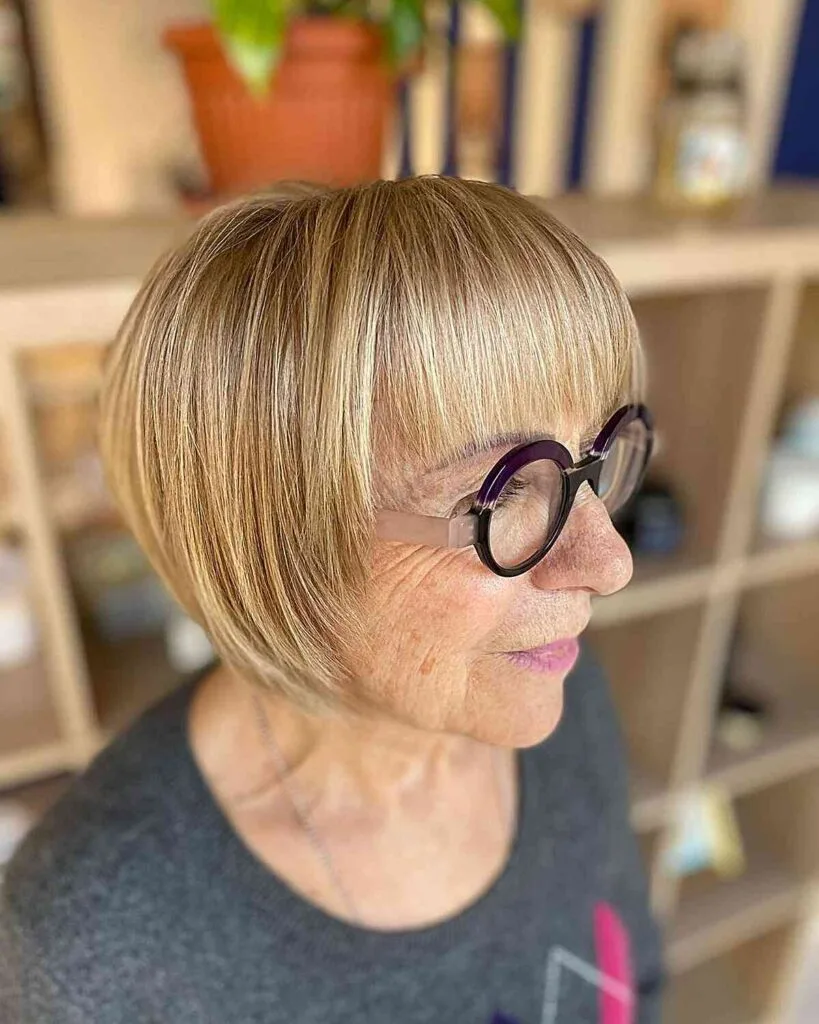 Stunning Golden Highlights on a Chic Bob for 60-Year-Olds with Glasses