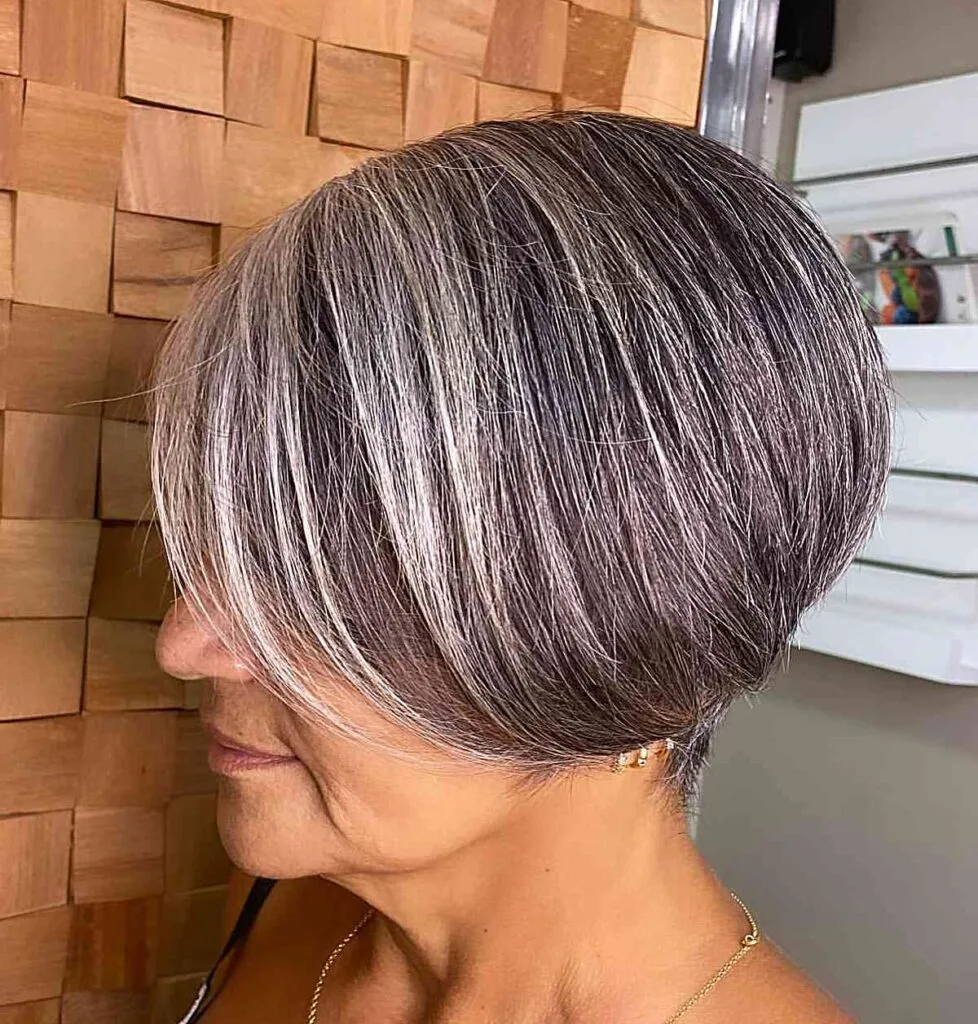 Stunning Gray Hair Color with Blonde Highlights for Women Aged 50