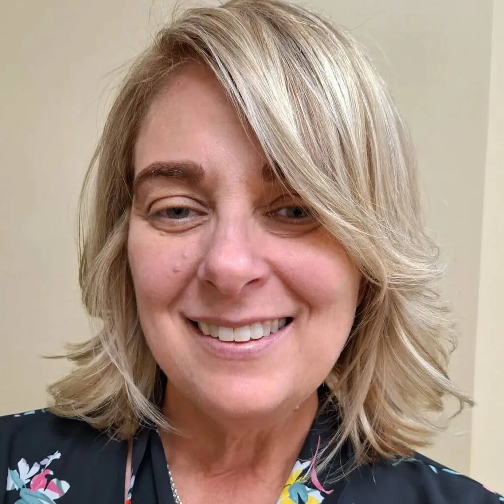 Stylish Medium-Length Cut with Soft Side-Swept Bangs