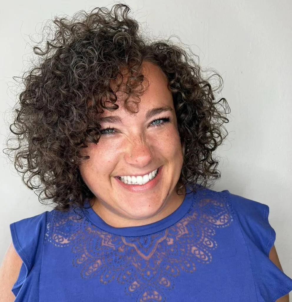 Textured Curly Cut with Soft Side-Swept Bangs