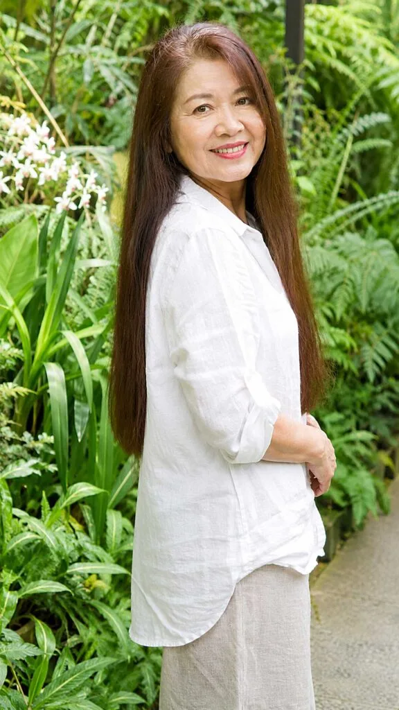 Very long straight chestnut hair seen from the side