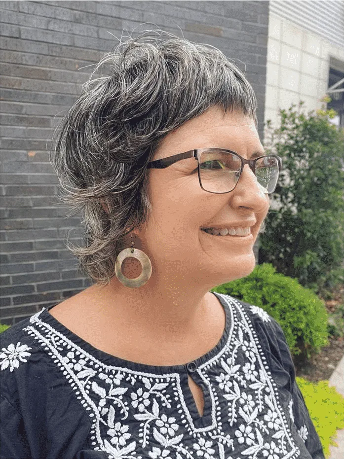 Woman over 50 with fine hair and Razor Shag with Glasses
