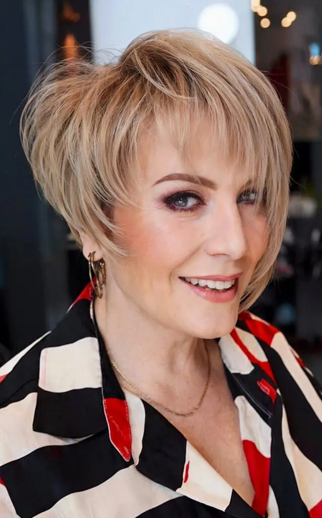 asymmetrical bob for ladies over 50 with grey hair