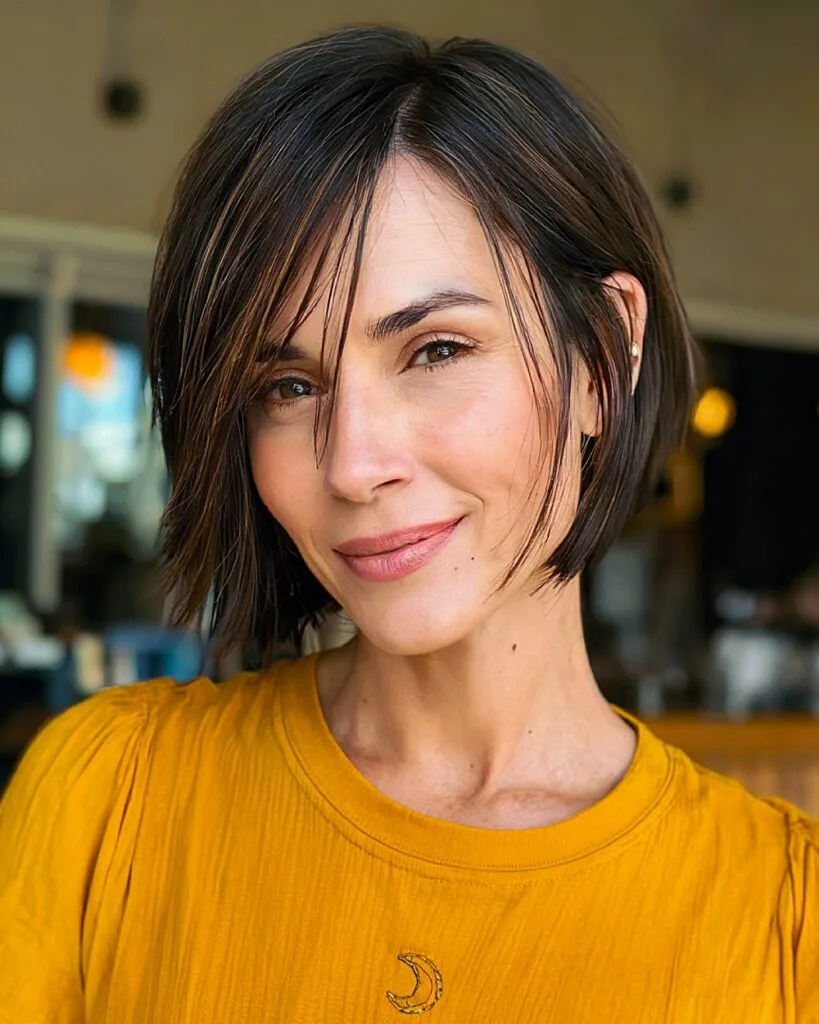 Asymmetrical bob with soft side bangs for women over 40 wanting a modern, low-effort hairstyle
