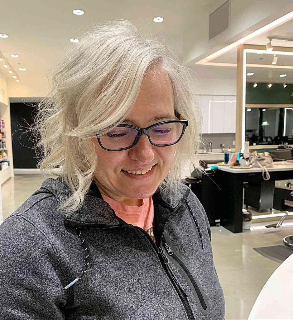 Chic Curly Chin Bob with Bright Platinum Highlights for Fine-Haired Ladies Aged 50