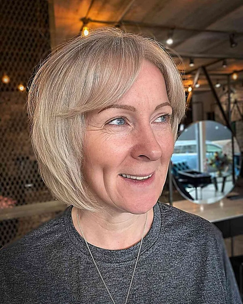 Chic Layered Bob with Curtain Bangs for Women Over 50 with Fine Hair