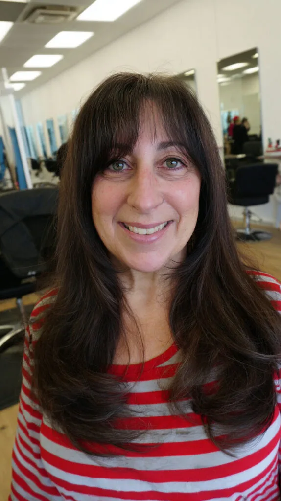Chic Long Layered Haircut with Face-Framing Bangs