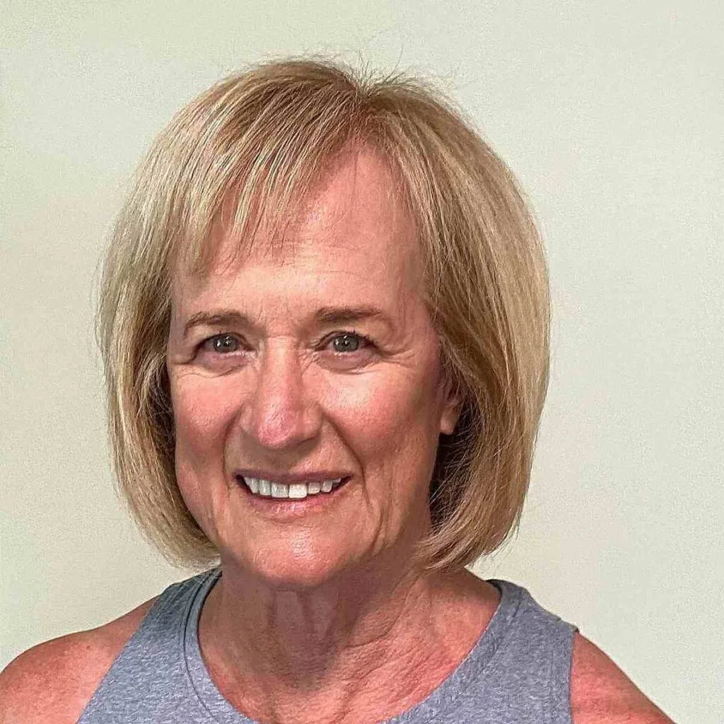 Chin-Length Bob Hairstyle with Short Side Bangs for Women Over Fifty