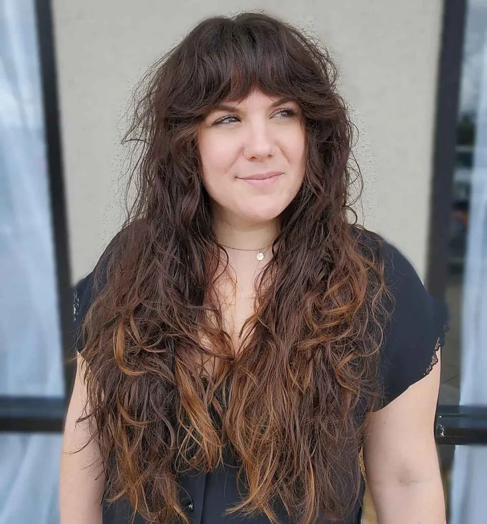 Effortless Long Curls with Bangs for a Woman Over 40 with Fine Hair