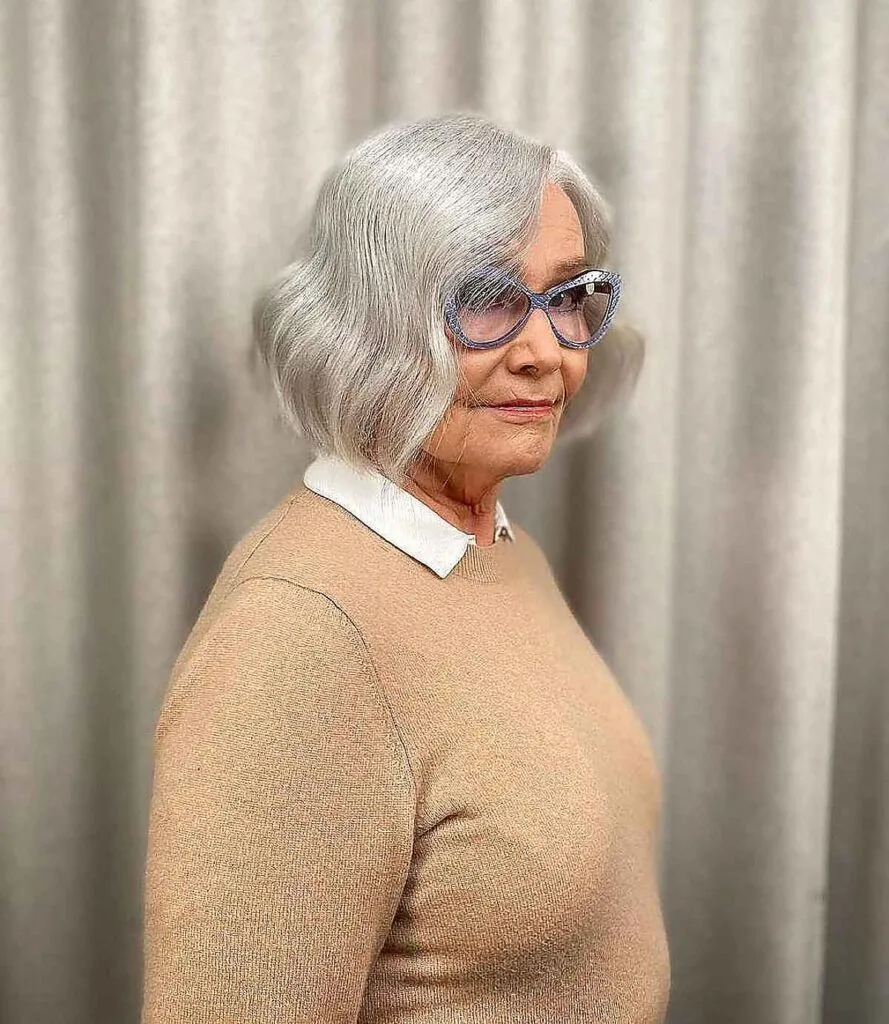 Elegant Wavy Bob on a woman over 60 with Fine Silver Hair