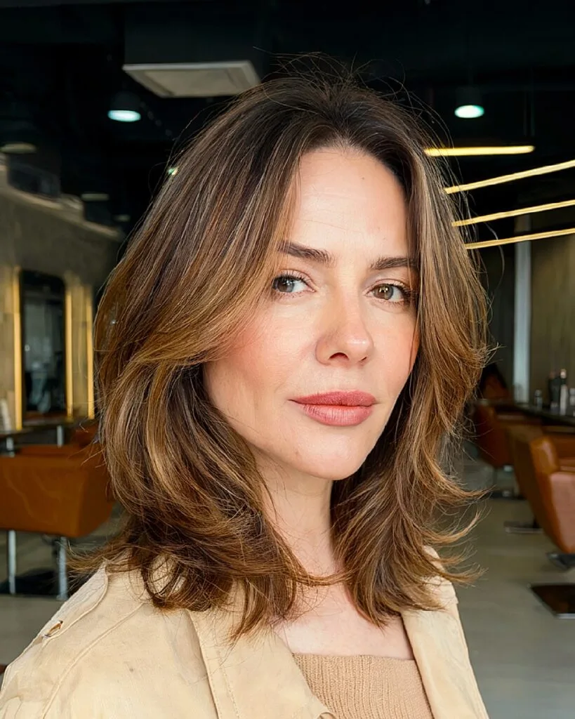 Face-framing collarbone-length haircut with layered ends for women over 40