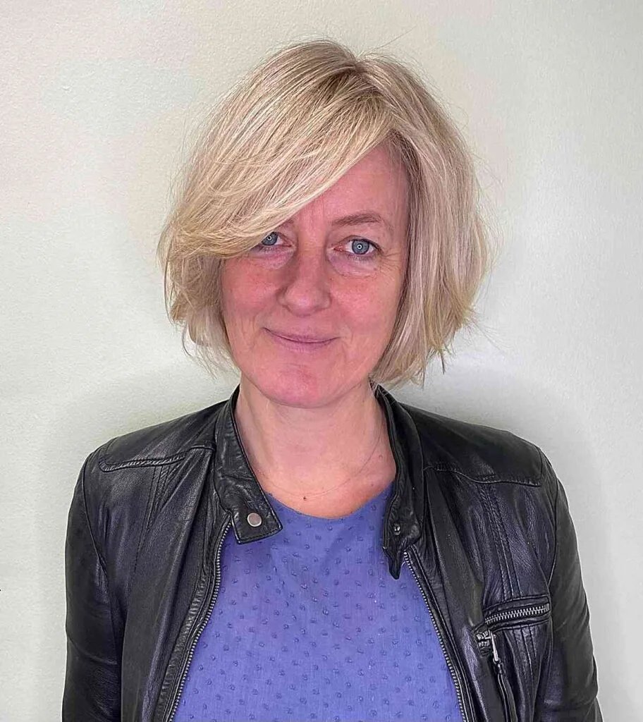 Jaw-Length Side Part Round Bob with Extended Bangs for Women Over 50 with Long Faces and Fine Hair