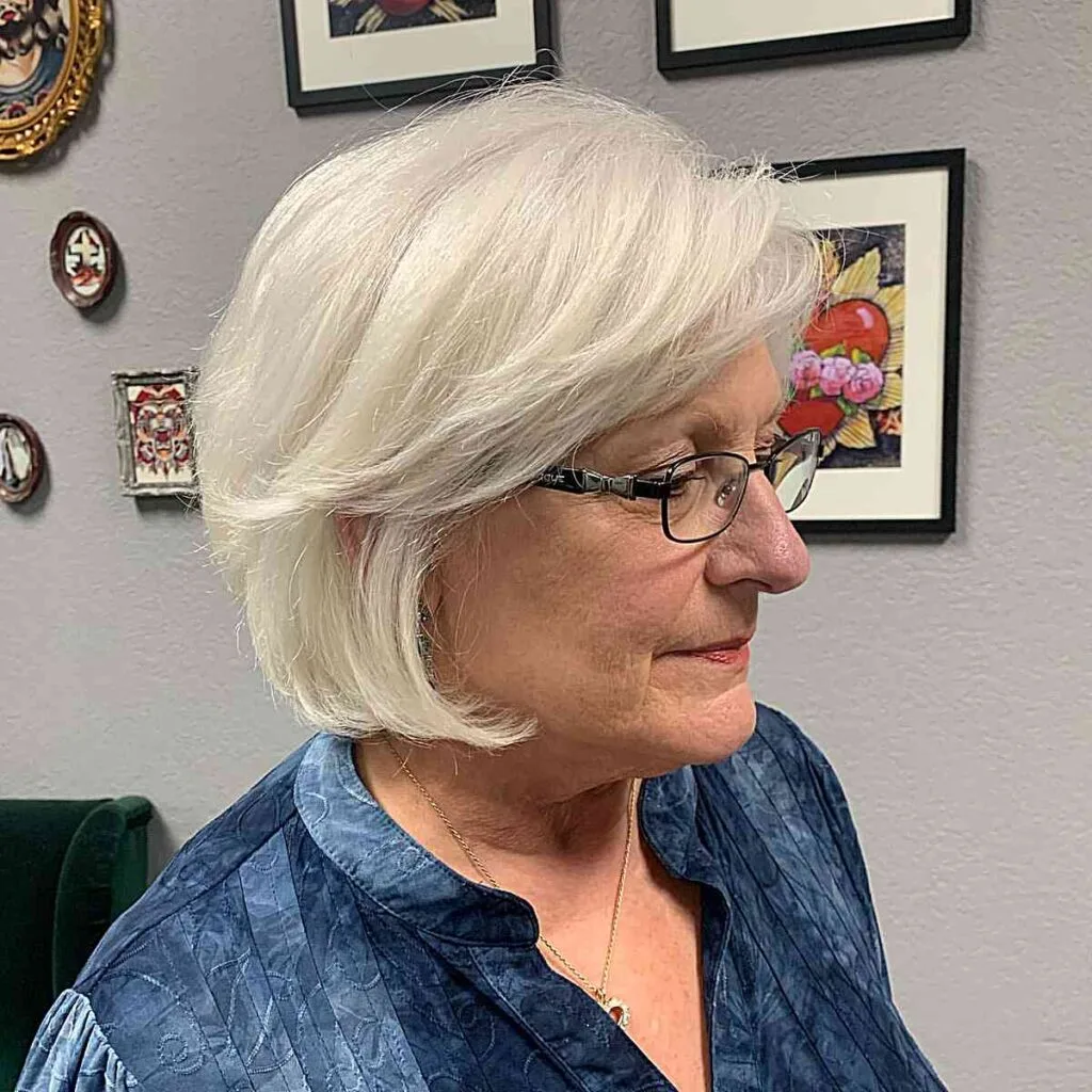 Jaw-Length Timeless Short Bob with Feathered Bangs for Older Women Aged 50 with Glasses