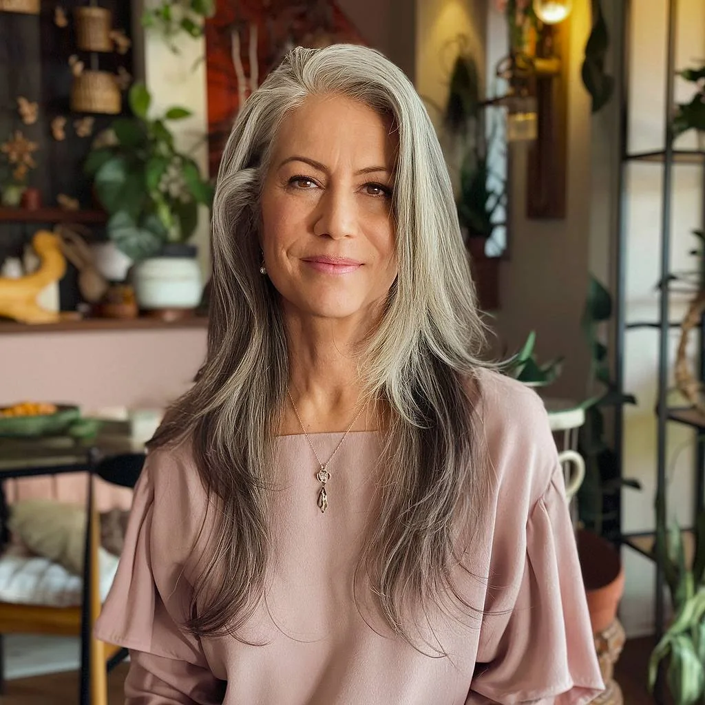 Long layered gray hair for older women with thin hair, styled for volume and movement