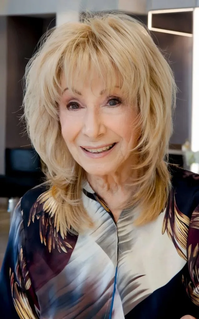 Medium Layered Shag with Wispy Ends and Bangs for Ladies Over Seventy