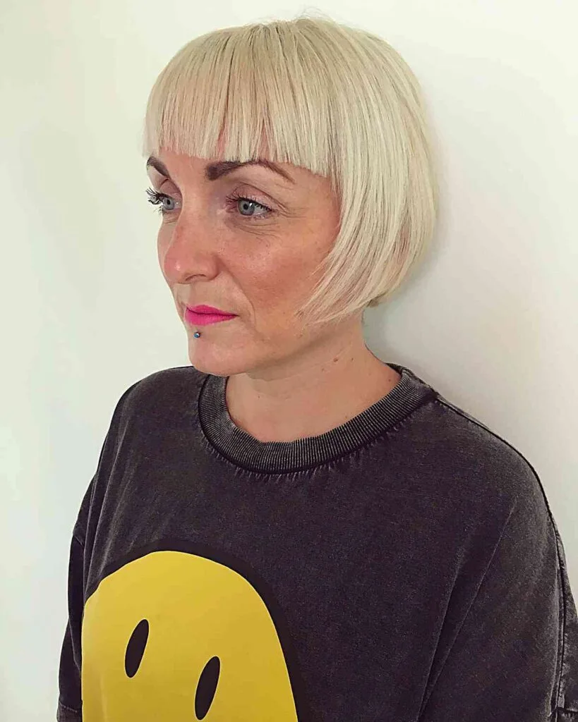 Medium-Length Hairstyle with Eyebrow-Grazing Bangs