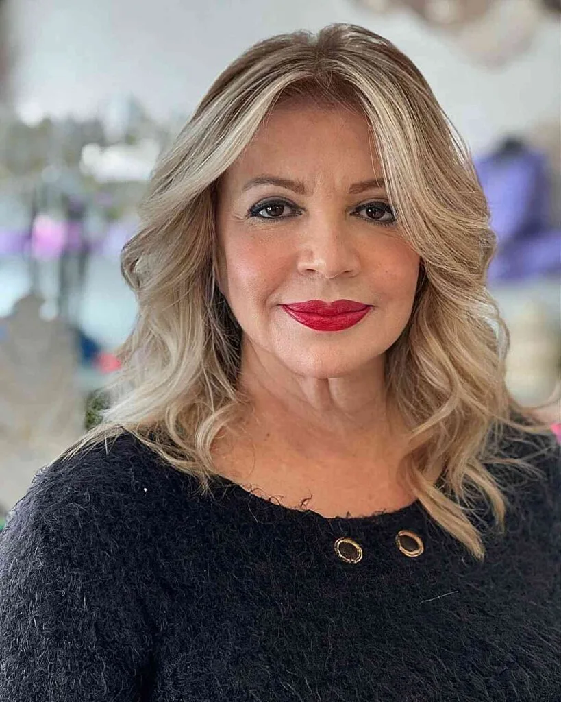 Mid-Length Blonde Hair with a Middle Part for 50-Year-Olds