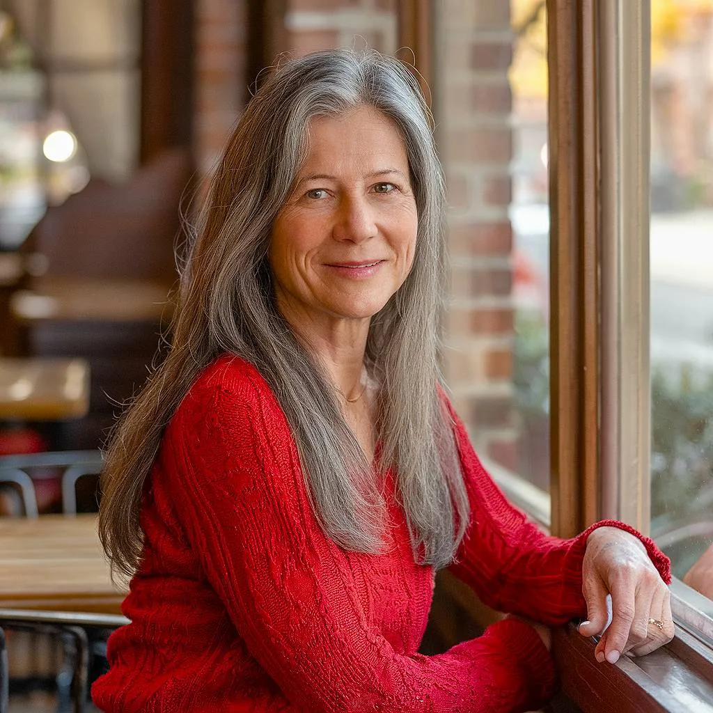 Natural, low-maintenance long hair for older women, with soft layers and a gray transition blend