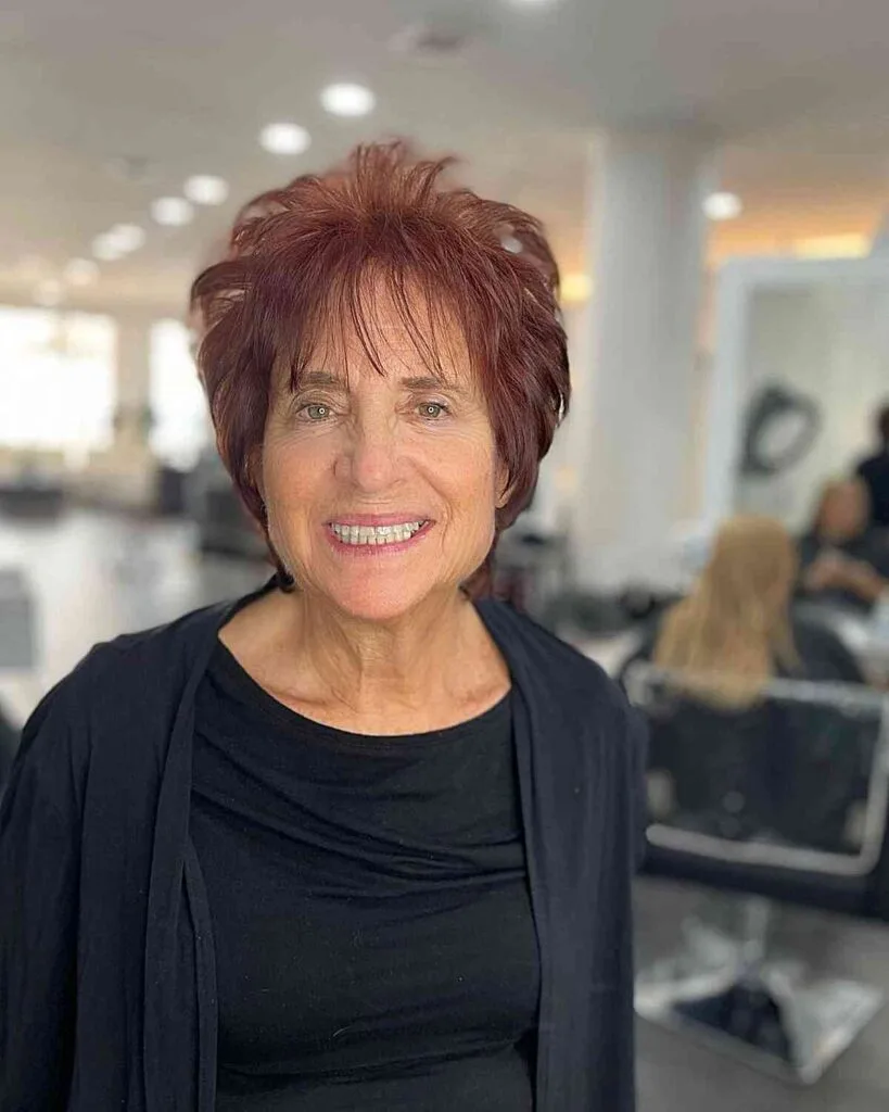 Short fluffy hair in dark ginger for women over 50 with fine hair