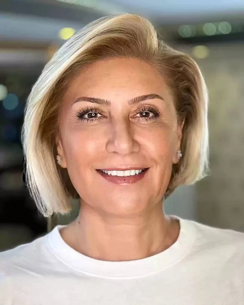 Short Side Parted Asymmetric Blonde Bob for Women Over Fifty
