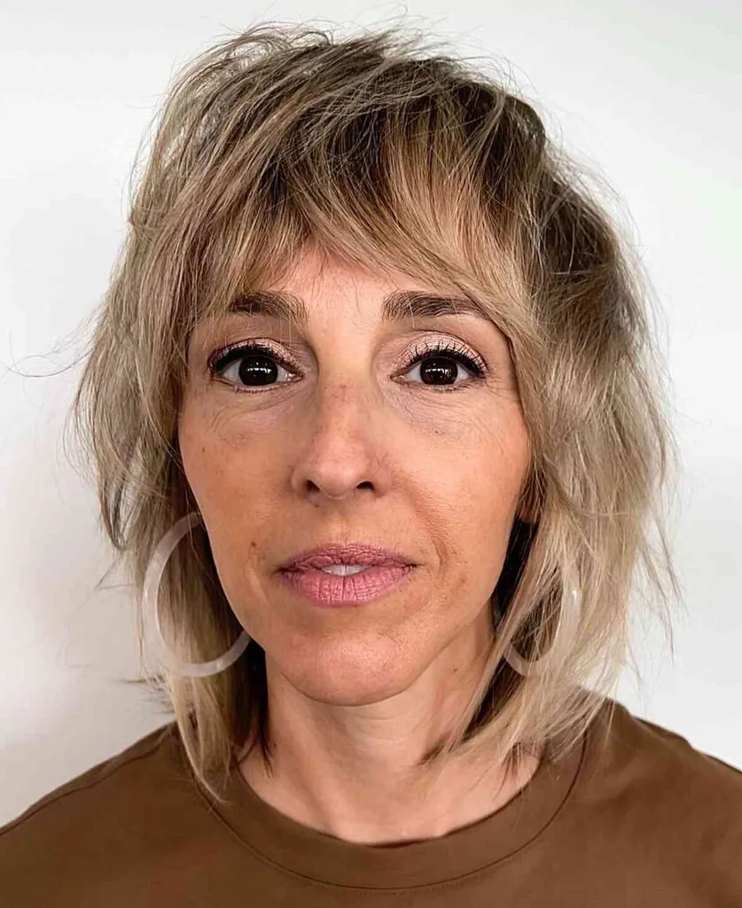 Shoulder-Grazing Textured Shaggy Long Bob with Fringe for Ladies in Their 50s with Fine Hair