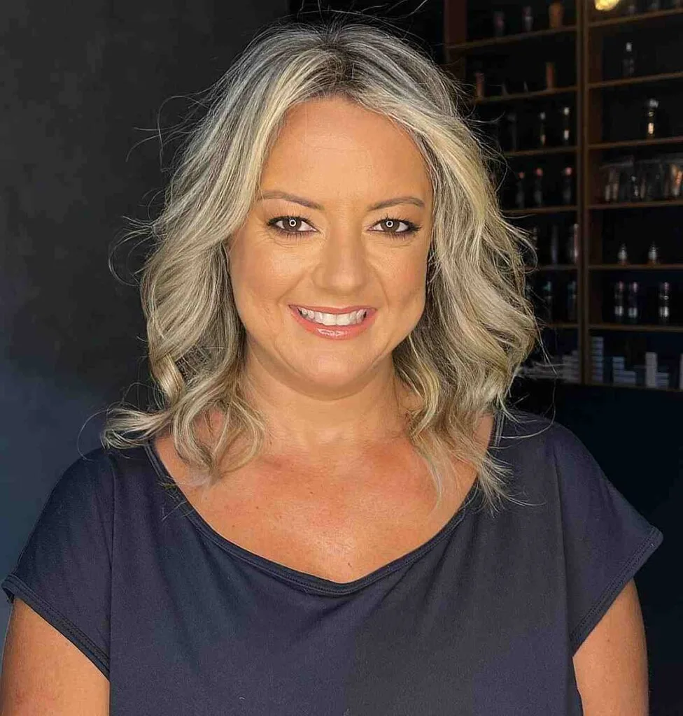 Shoulder-Length Loose Blonde Curls for Ladies Over Fifty