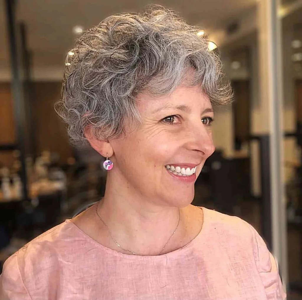 Soft Silver Pixie with Natural Curls and Short Curtain Bangs for Women Over 50