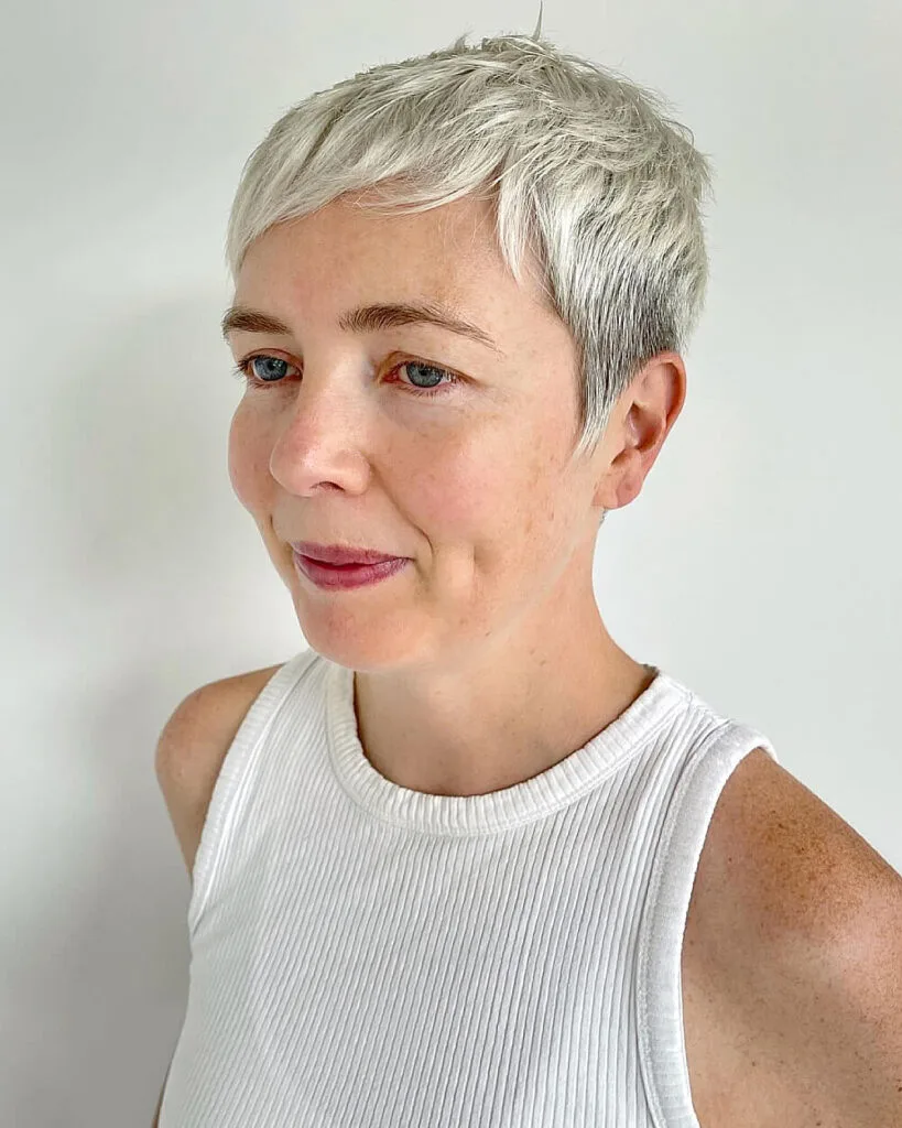 Textured silver pixie crop with choppy layers, perfect pixie haircut for women over 50 with fine straight hair