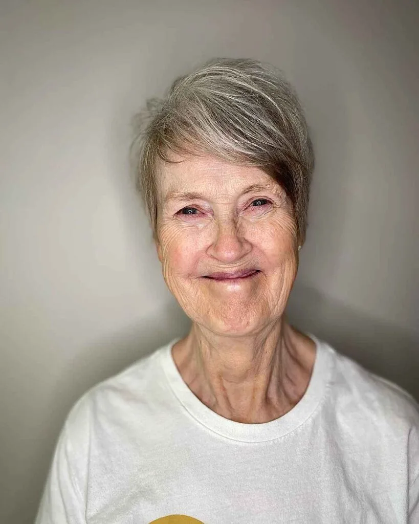 Chic Grey Pixie Cut for Women Aged 50 with Eyeglasses and a sweeping fringe
