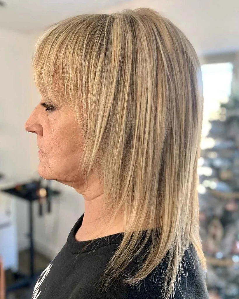 Choppy Bangs with a Mid-Length Straight Shag for Women Over 60