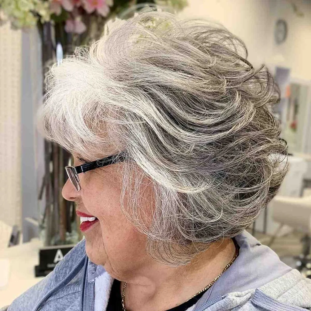 feathered bob for women over 50 with glasses
