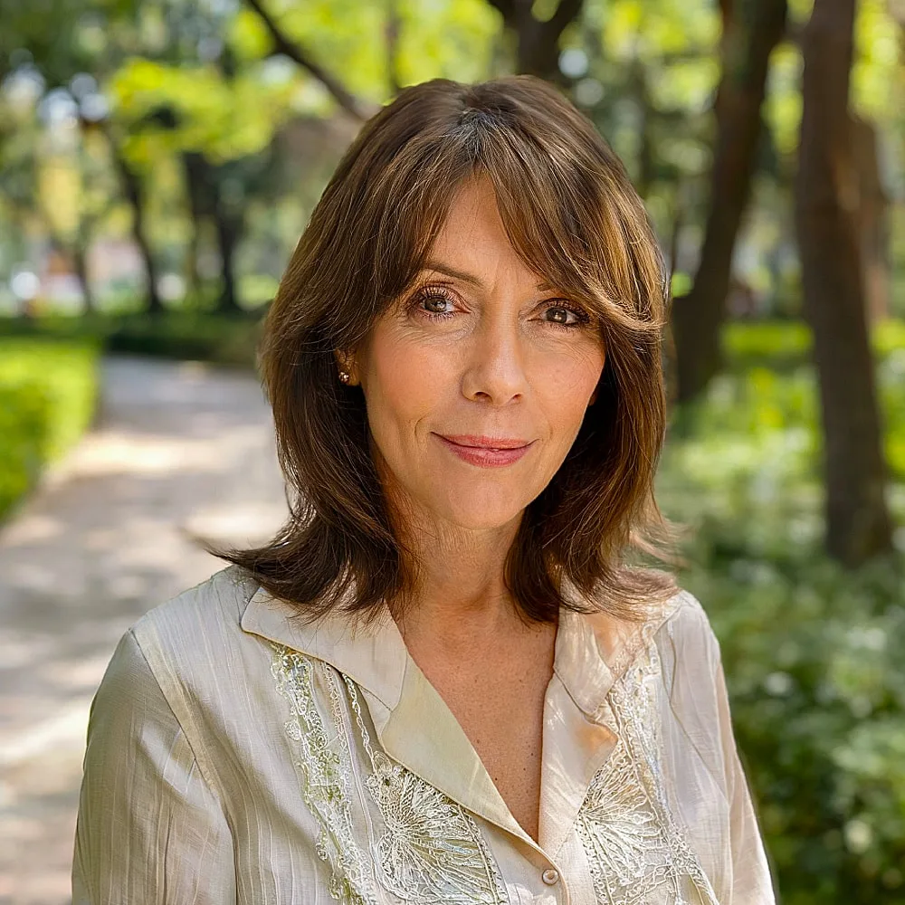Long bob with curtain bangs for mature women with fine hair and a layered finish