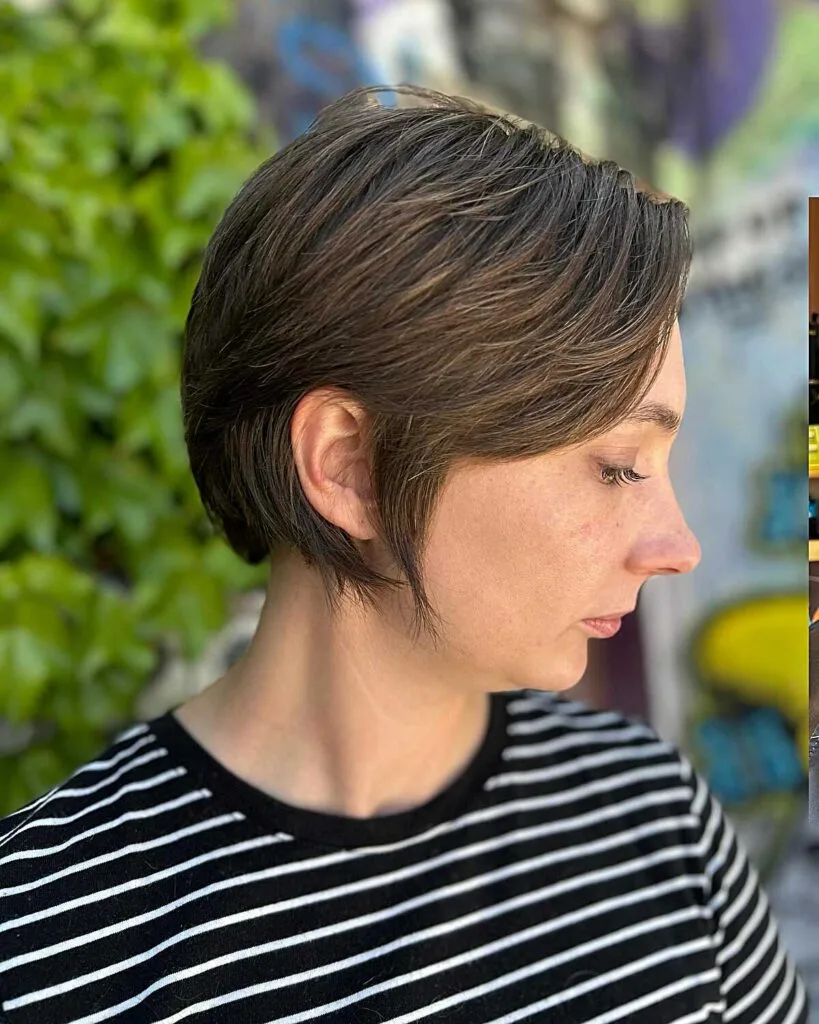 Short brunette bixie with feathered layers and side part