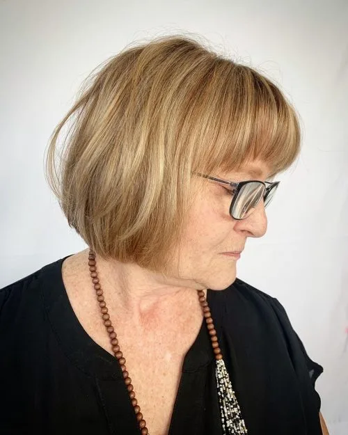 Short informal bob hairstyle for women in their 50s who wear glasses