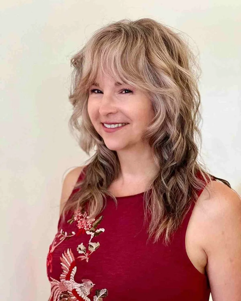 Shullet with Bangs and Loose Waves for a Lady Over 40