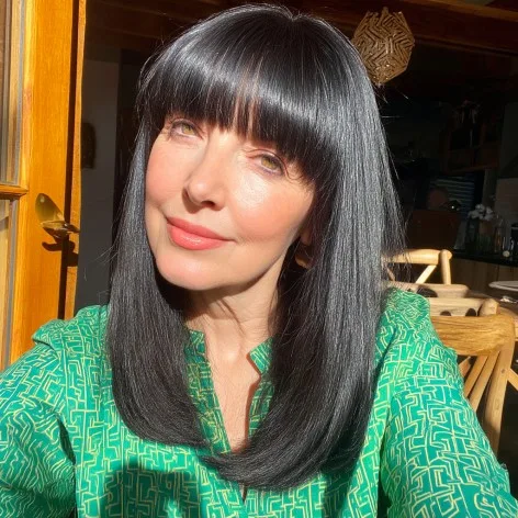 Sleek Long Cut with Bold Bangs for Women Over 50