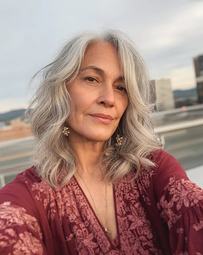 Soft gray blending with blonde highlights and neutral lowlights over 50