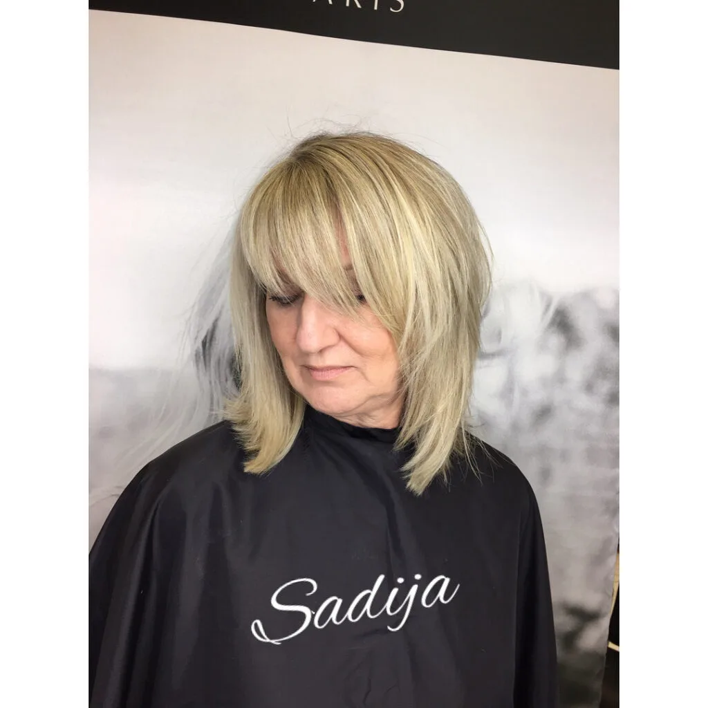 Softly Textured Shoulder-Length Bob with Wispy Bangs