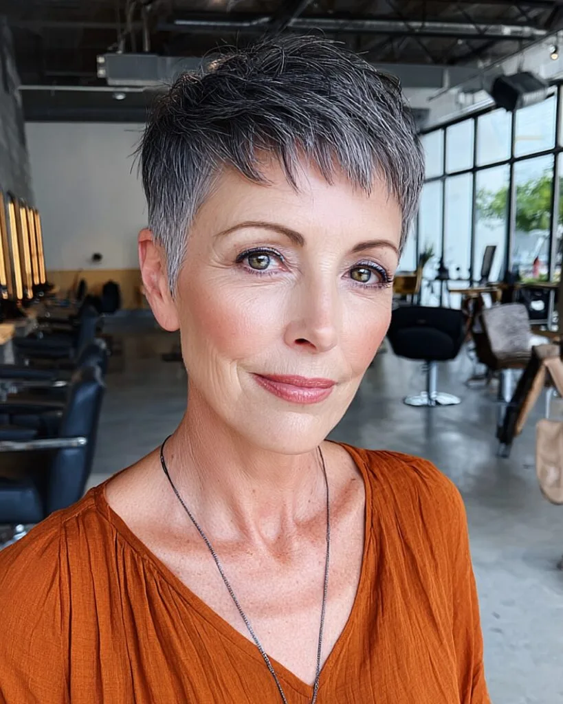 Super short gray pixie with wispy bangs for older women with straight fine hair