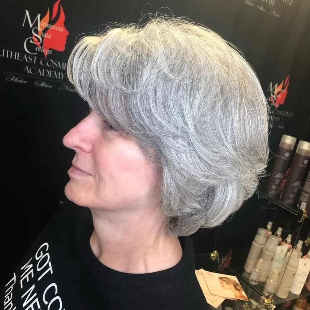 Textured shaggy bob for mature women with layered hair.