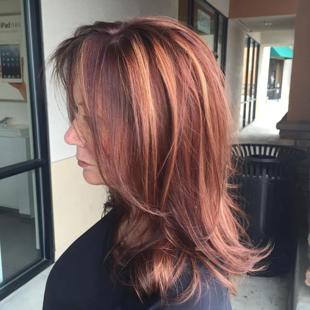 Warm Auburn Layered Shoulder-Length Bob with Subtle Highlights