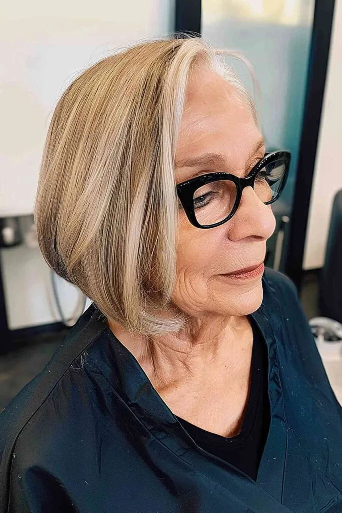A-Line Bob with blonde highlights that enhances a youthful appearance for women over 70.