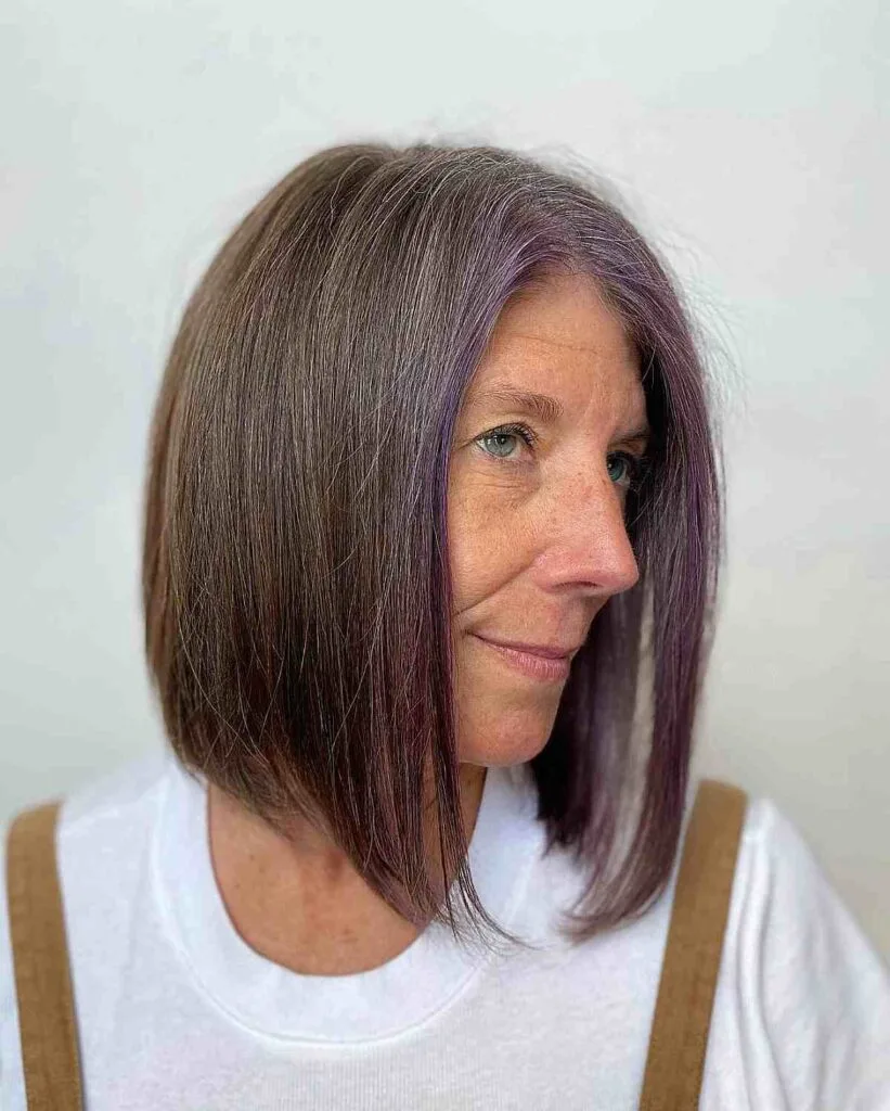 Asymmetrical Brunette Lob Featuring a Purple Money Piece for Older Women