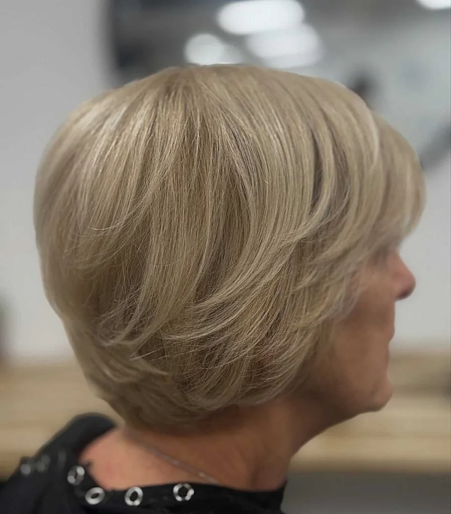 Classic ash blonde bixie with layered crown and tapered nape