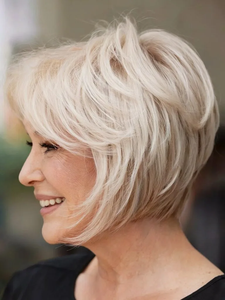Classic Wedge Feathered Bob with Subtle Layers for Older Ladies Past 60 with Blonde Hair
