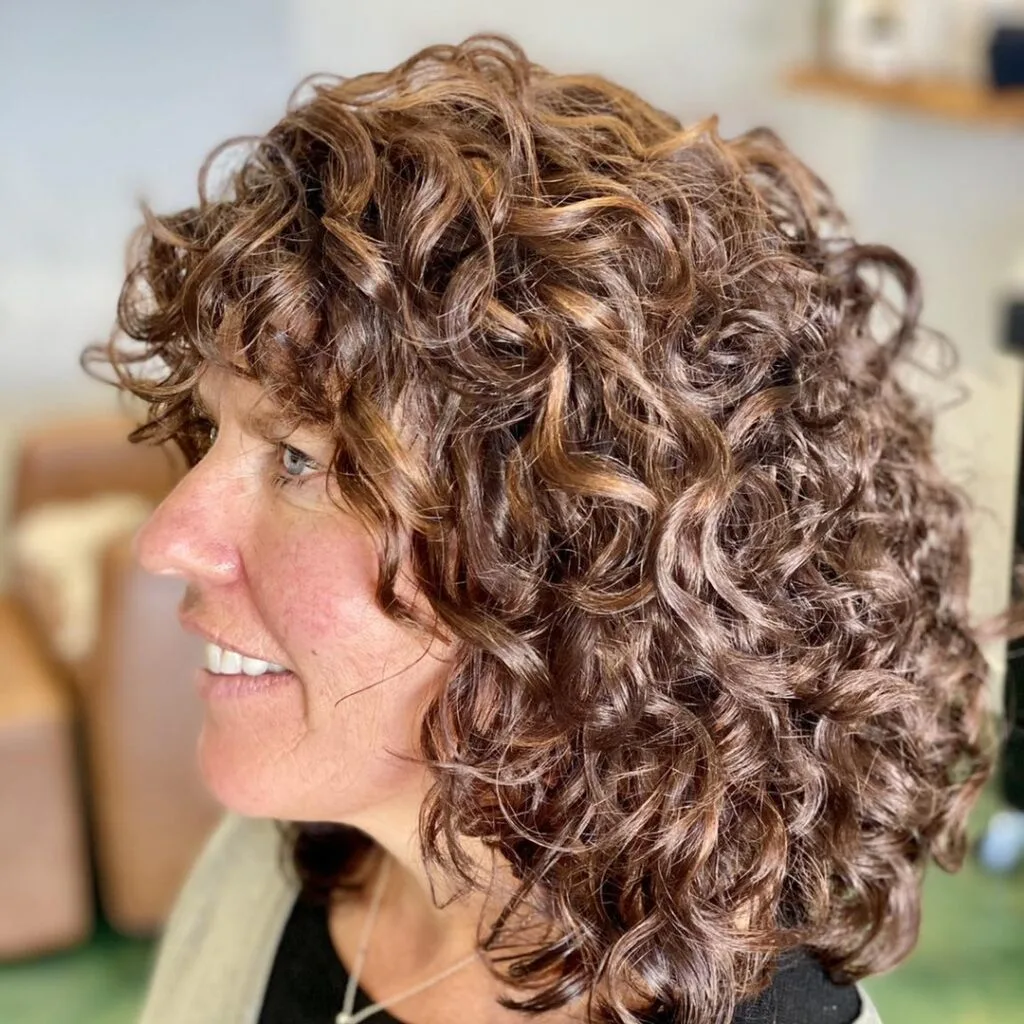 Dynamic Curly Shag with Warm Highlights