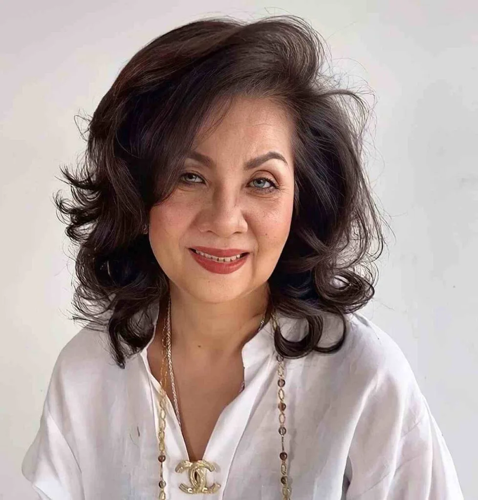 Feathered Mid-Length Hair with Gentle Waves for Older Women