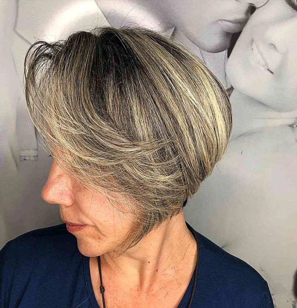 Jaw-Length Rooted Blonde Bob with Long Side Bangs and Stacked Layers for Older Women Past 60