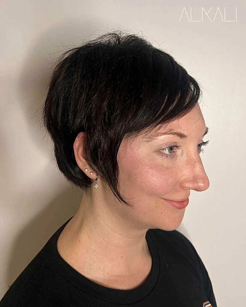 Jet black textured bixie with sideburns and volume