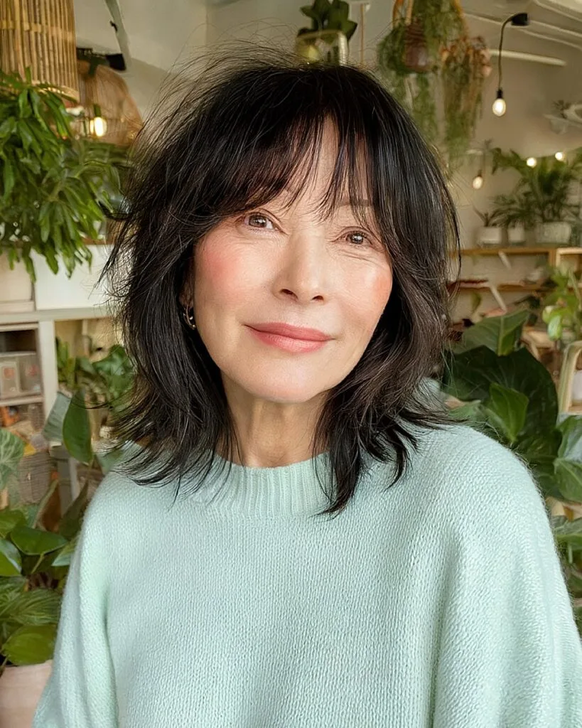 Korean-inspired shag haircut with wispy layers and soft fringe for playful women over 50